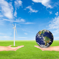 hand holding wind turbine and earth
