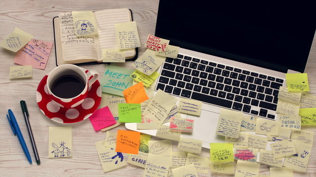 Office desk covered by post it papers - timelapse HD