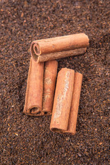 Cinnamon stick on dried and processed tea leaves