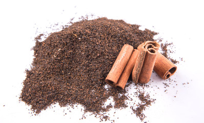 Cinnamon stick on dried and processed tea leaves