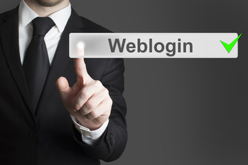 businessman pushing flat button weblogin