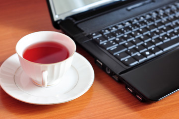 Laptop and a cup of tea