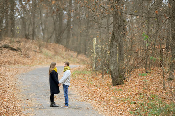 Fototapeta premium Pair of loving hearts walk in the autumn park