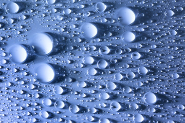 Blue Water Droplets abstract background - big and small drops