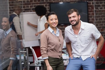 Confident young business people in office