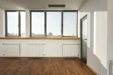 Empty room with parquet floor 