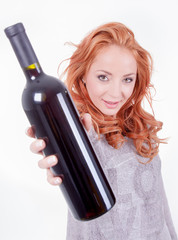 Woman holding a red wine bottle