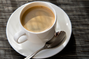 morning cup of espresso in the morning sun