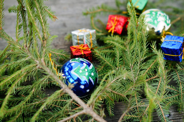 Christmas balls and gifts are under the tree