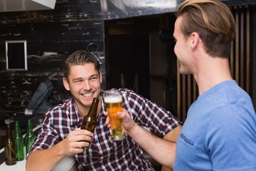 Young men drinking beer together