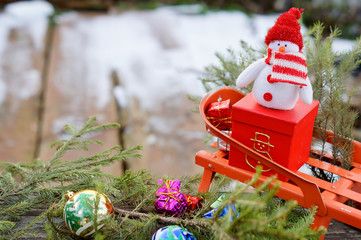Christmas Snowman on red box and sledding