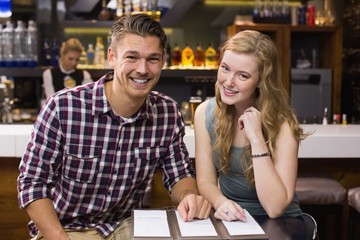 Young couple discussing the menu