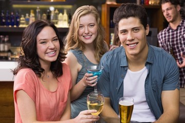 Young friends having a drink together