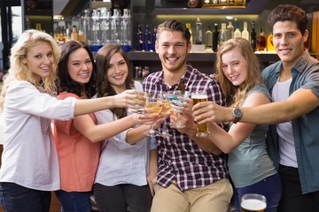 Young friends having a drink together
