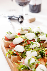 Tomato, mozzarella and arugula sandwich