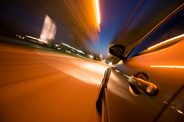 Fototapeta na wymiar Car in motion at night