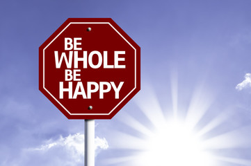 Be Whole Be Happy written on red road sign
