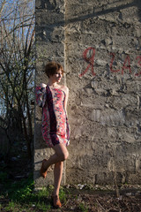 The pregnant girl on walk in city park