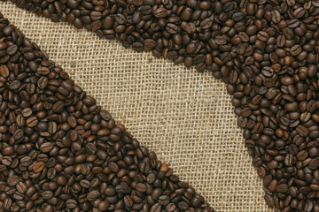 Caffe edition, coffee beans on Jute background