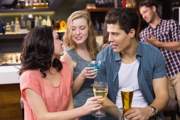 Young friends having a drink together