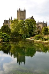 Fototapeta na wymiar Wells cathedral and water reflections