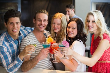 Young friends having a drink together