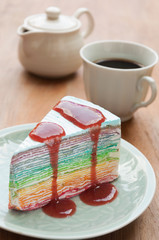 Rainbow crape cake on plate. (Selective Focus)