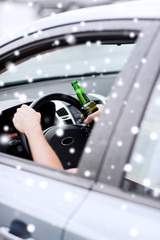 close up of man drinking alcohol while driving car