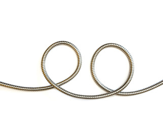 two circles formed by flexible metal hose