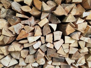 Stacked logs firewood, natural pattern background