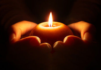 Fototapeta premium prayer - candle in hands