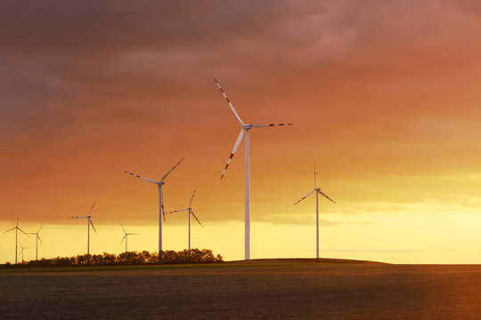Wind turbine, wind power at sunset