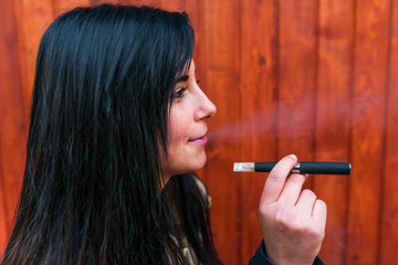 Woman smoking with electronic cigarette