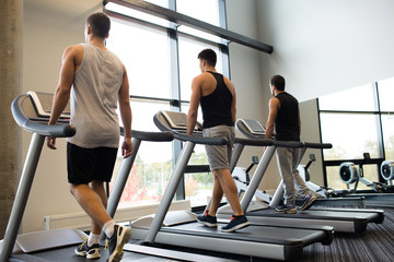 men exercising on treadmill in gym