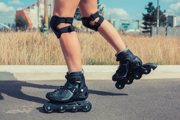 Woman rollerblading on sunny day
