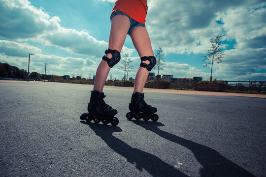 Young woman rollerblading on sunny day