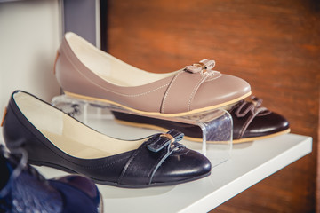 Fototapeta na wymiar women's shoes on the shelf in the shop sale