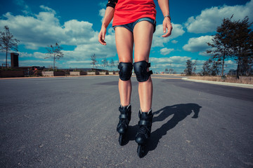 Young woman rollerblading on sunny day