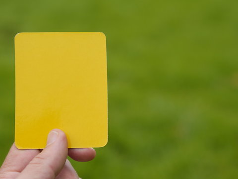 Referee Hand With Yellow Card