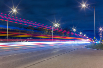 Road traffic and light trails at night