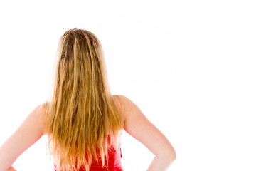 Obraz premium model isolated on plain background back hands on hips
