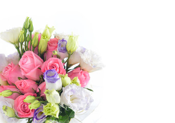 Bouquet of white rose and lisianthus flowers isolated on white