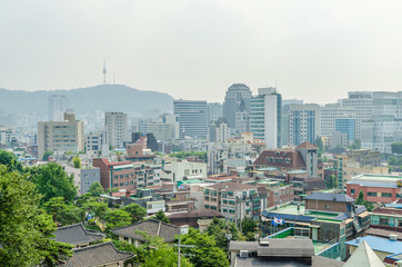 Naklejka premium Cityscape of seoul and seoul tower on a mountain at south korea