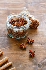 anise and cinnamon on wooden background