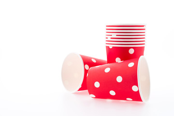 Red polka dot paper cup isolated on white background