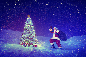 Obraz na płótnie Canvas Santa Claus Christmas Tree Snow Concept