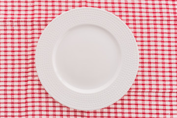 White coffee cup on tablecloth