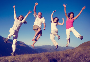 Group of People Jumping Happiness Outdoors