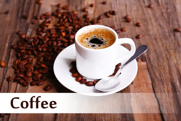 Cup of coffee and coffee beans on wooden background