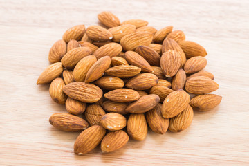 Almond on wooden background
